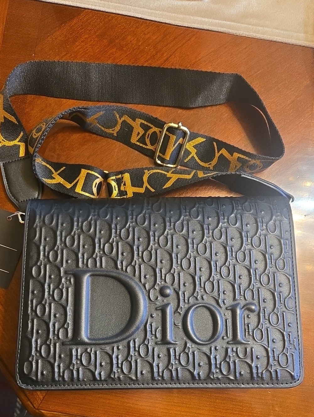 Embossed Black Crossbody Bag with Detachable Logo Strap. Messenger Bag
